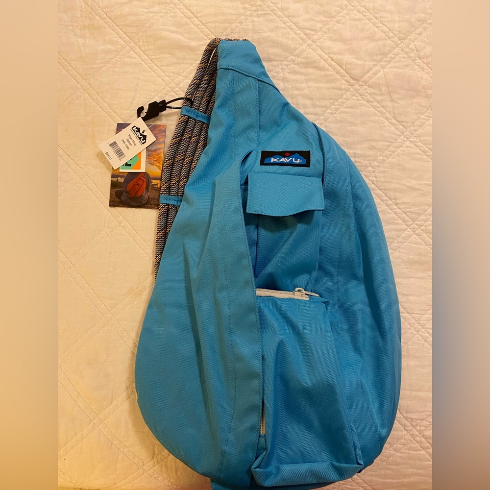 Blue kavu over the shoulder backpack
